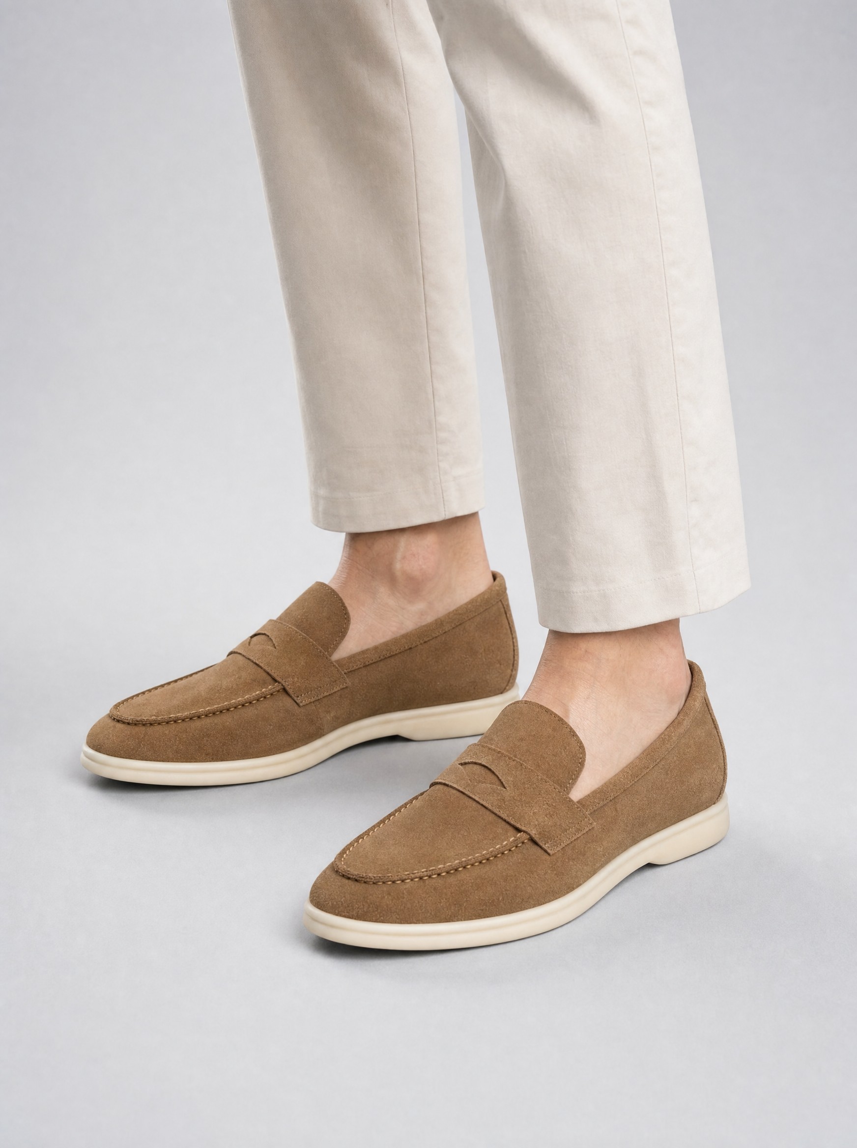 Suede Penny Loafers in khaki, AI-rendered on the house model from the product photo