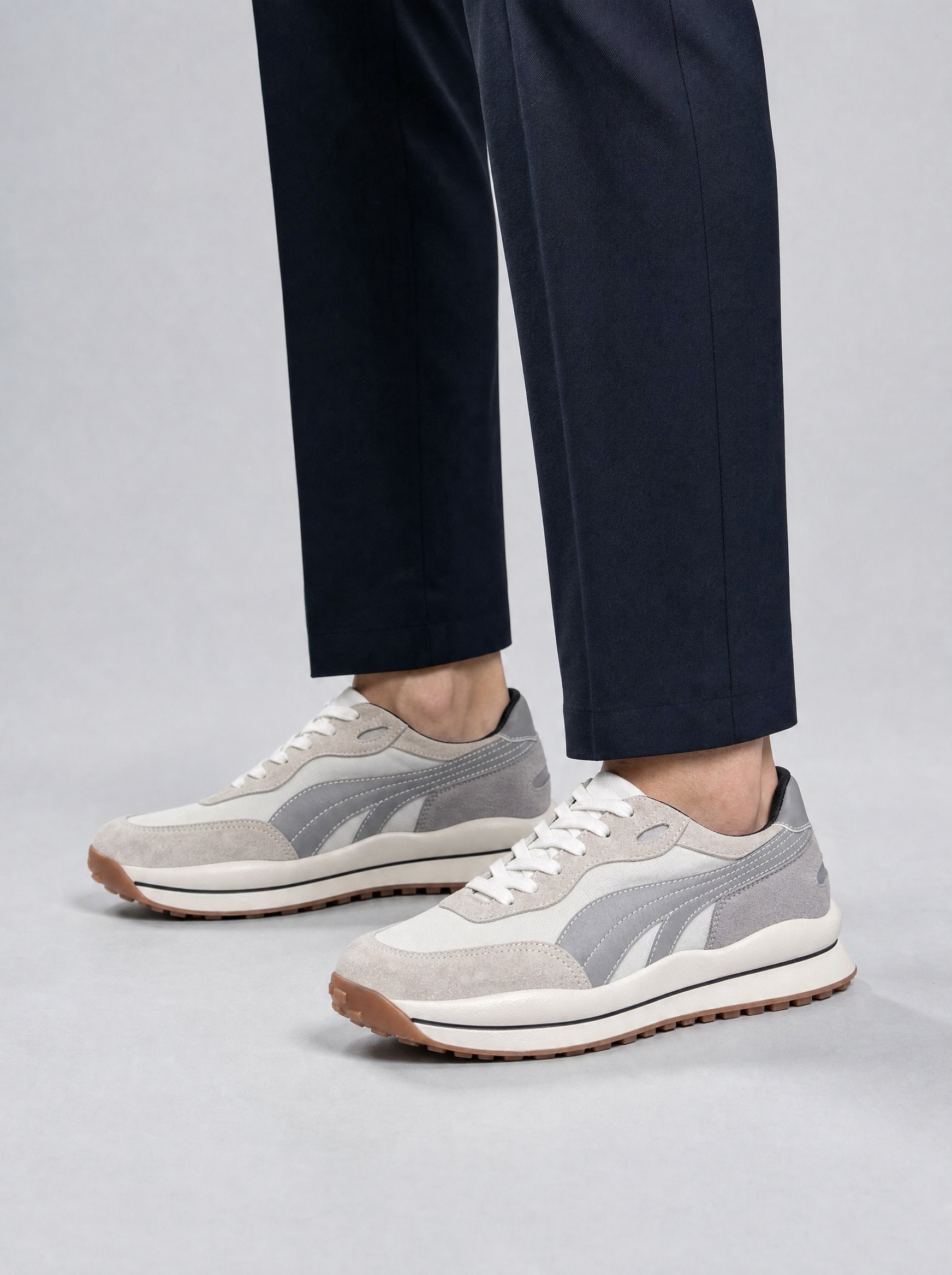 Suede Retro Runner in grey, AI-rendered on the house model from the product photo