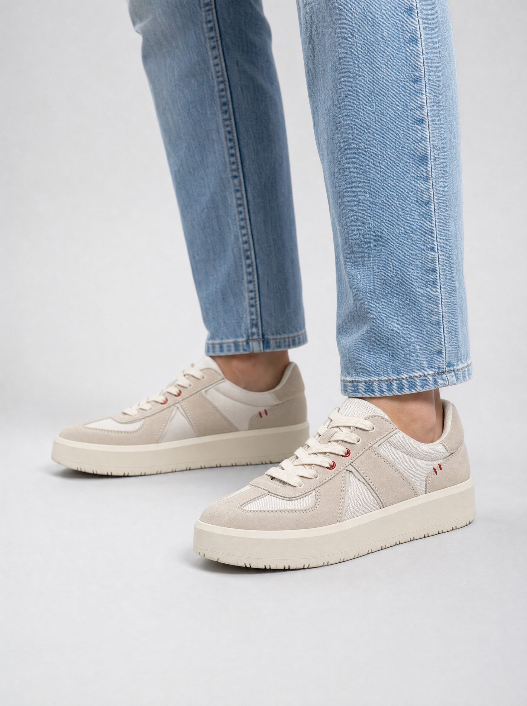 Platform Army Trainer in off-white, AI-rendered on the house model from the product photo