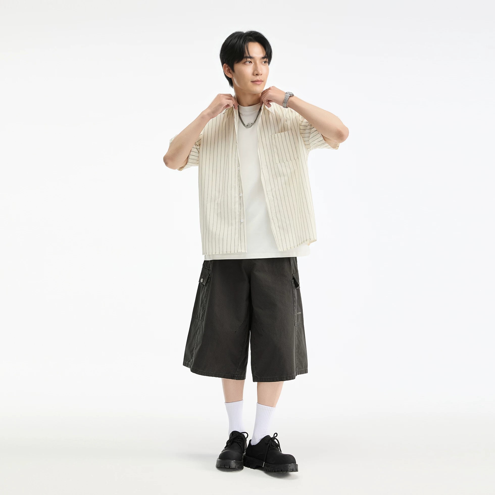 Striped Cotton Boxy Shirt in white, worn by the house model